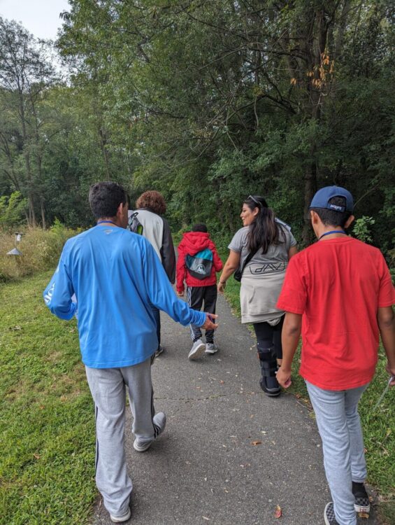 Group of trail trekkers participants walking along Paint Branch heartsmart trail