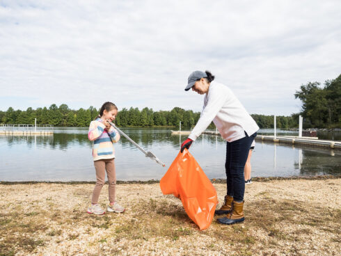 Mother and daughter removing litter from our parks.