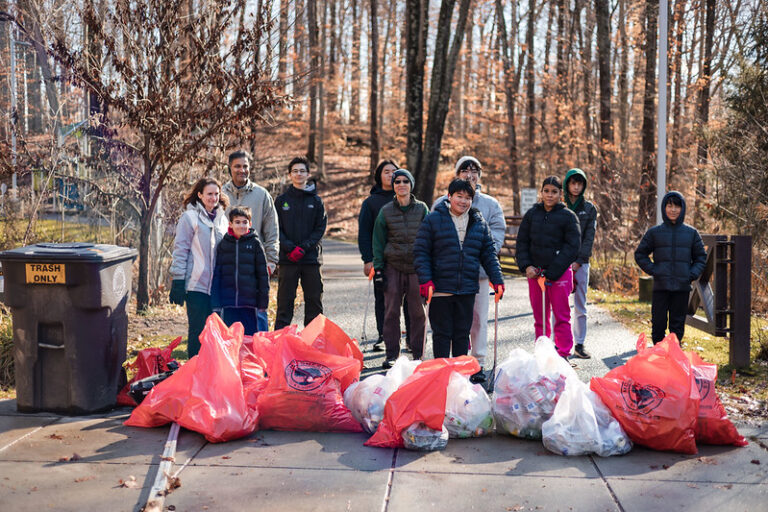 Group photo of volunteers from the cleanup at Wheaton Claridge Local Park for MLK Day