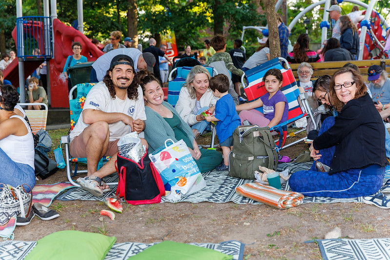 Family enjoying live music at Flower Avenue Urban Park