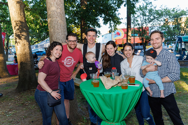 Adults enjoying beverages with their babies at Flower Avenue Urban Park