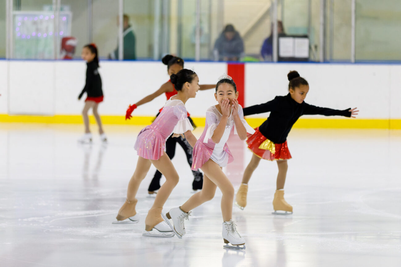 A smiling figure skater