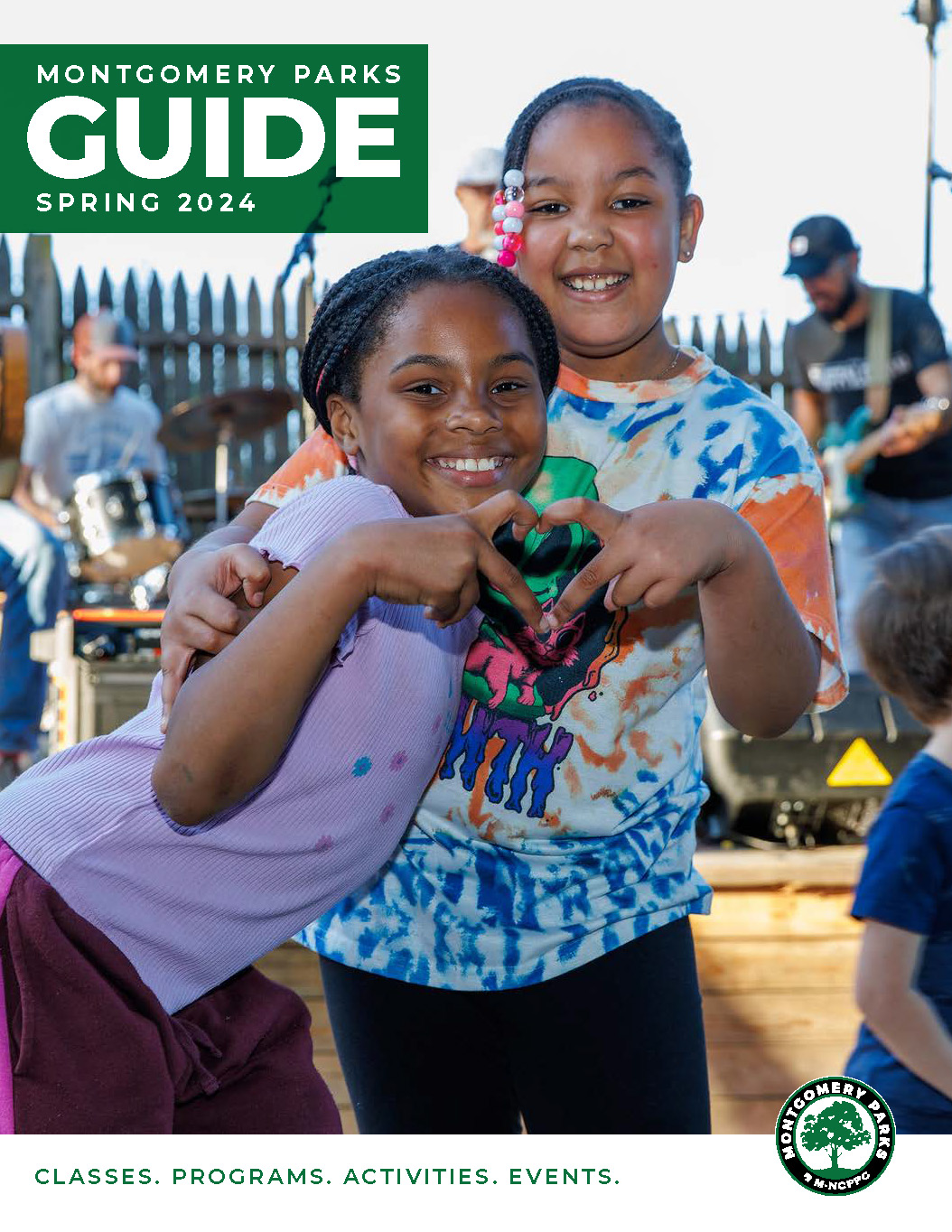 Two girls form a heart with their fingers. Text reads Montgomery Parks Guide Spring 2024