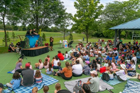 Stage and audience from Puppet Co show at Falls Road Local Park
