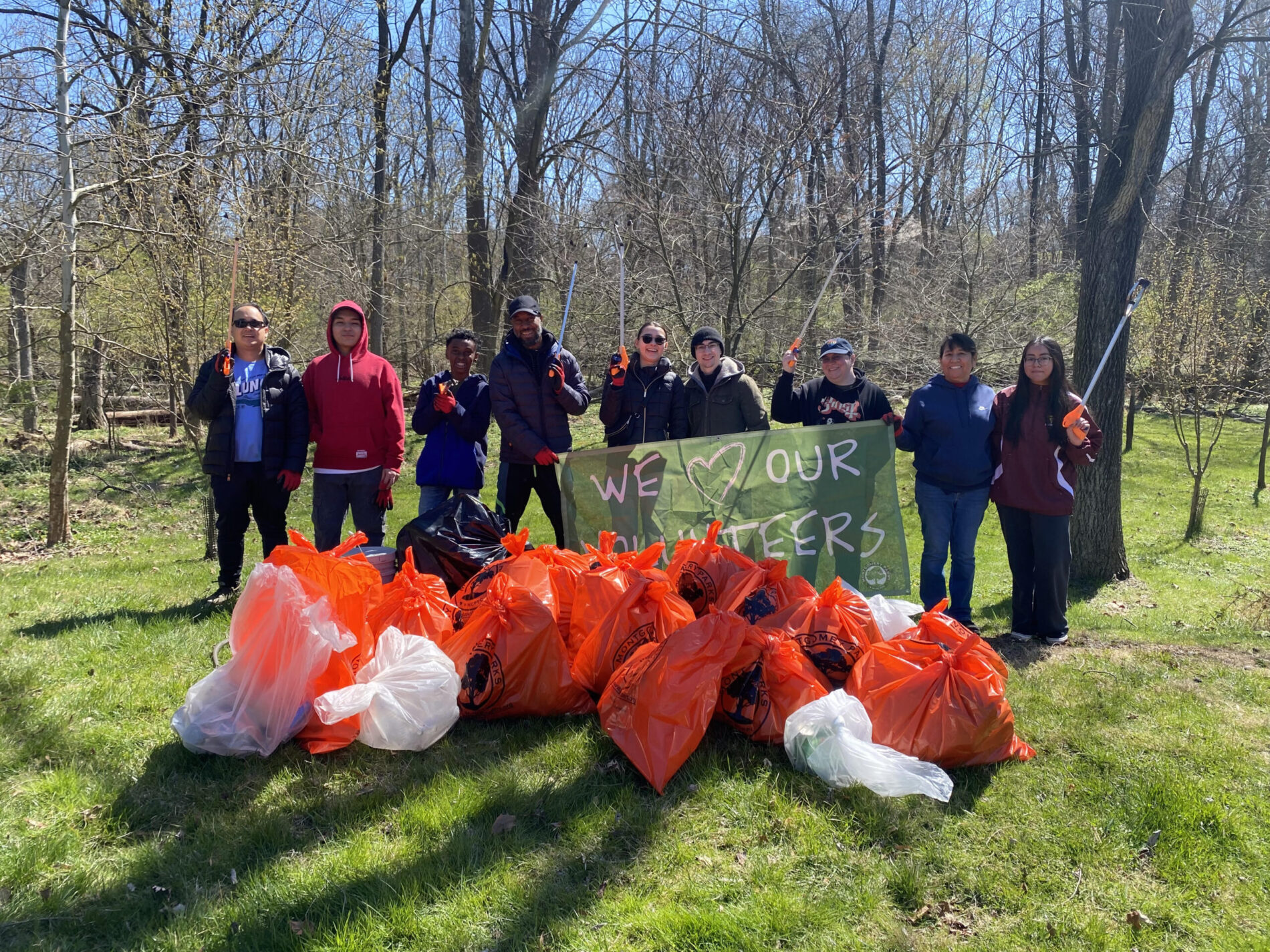 volunteers with trash matthew henson cleanup