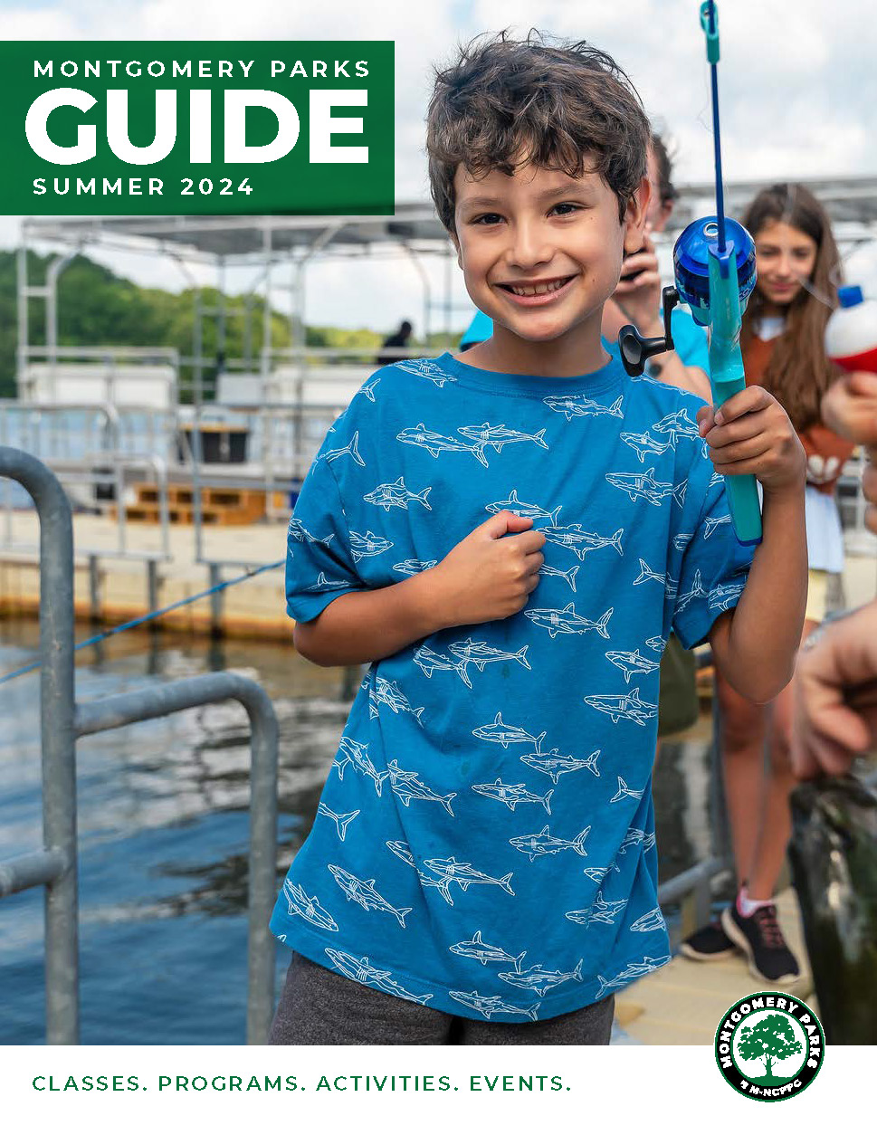 Youth smiling while holding a blue fishing rod. Text reads Montgomery Parks Guide Summer 2024