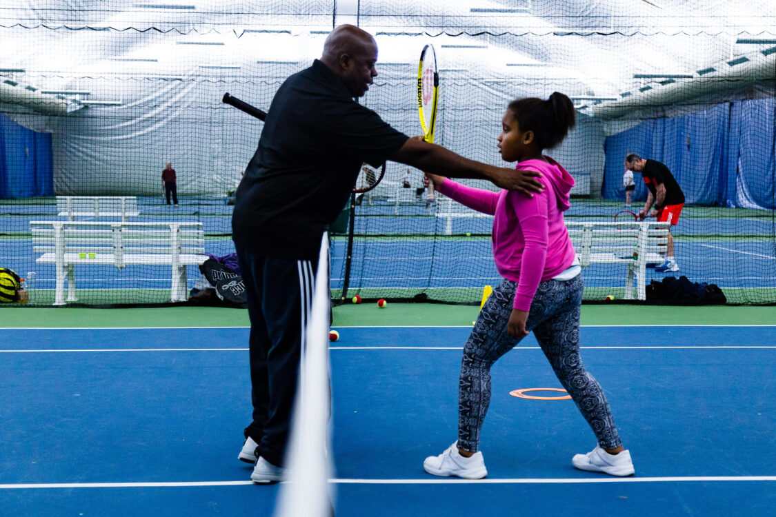 child getting tennis lesson at wheaton indoor tennis