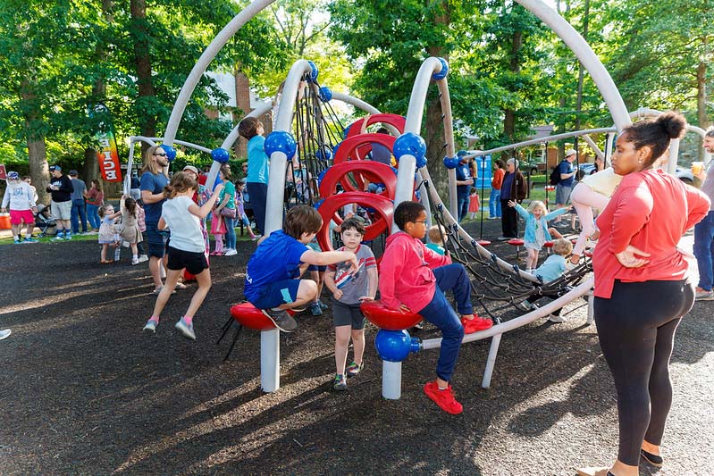 playground filled with kids at flower urban park at acoustics and ales