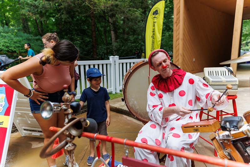 children invited on stage to say hello to clowns at Happenstance Theater in summer 2023