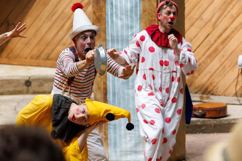 two clowns performing at Happenstance Theater production in summer of 2023