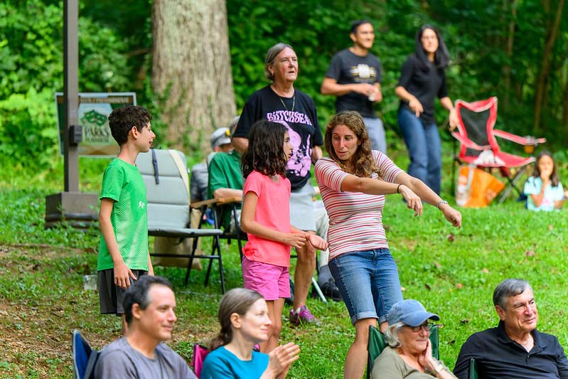 park visitors dancing at Montgomery parks  summer concert