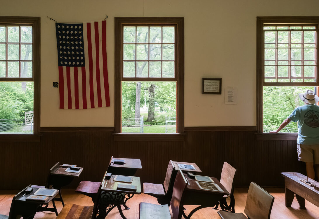 A view of the desks and windows inside Kingsley Schoolhouse