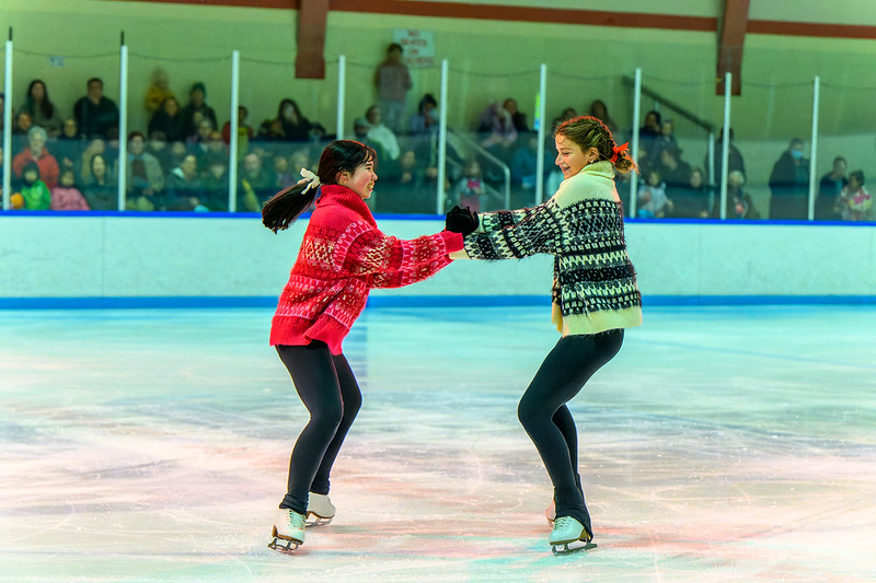 two girls spinning on the ice