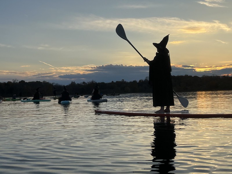 Person in witch costume paddling on Little Seneca Creek