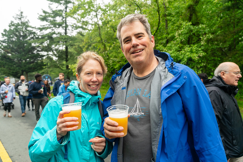 Couple holding beer up for a picture