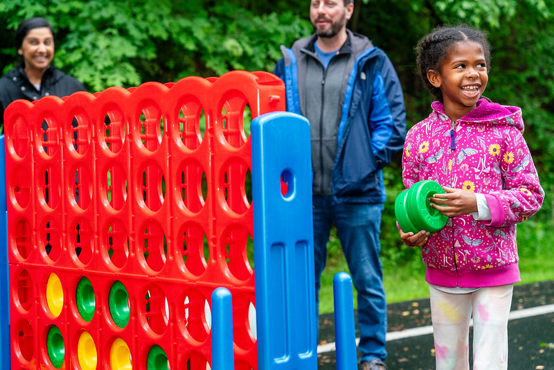 Young girl playing connect 4