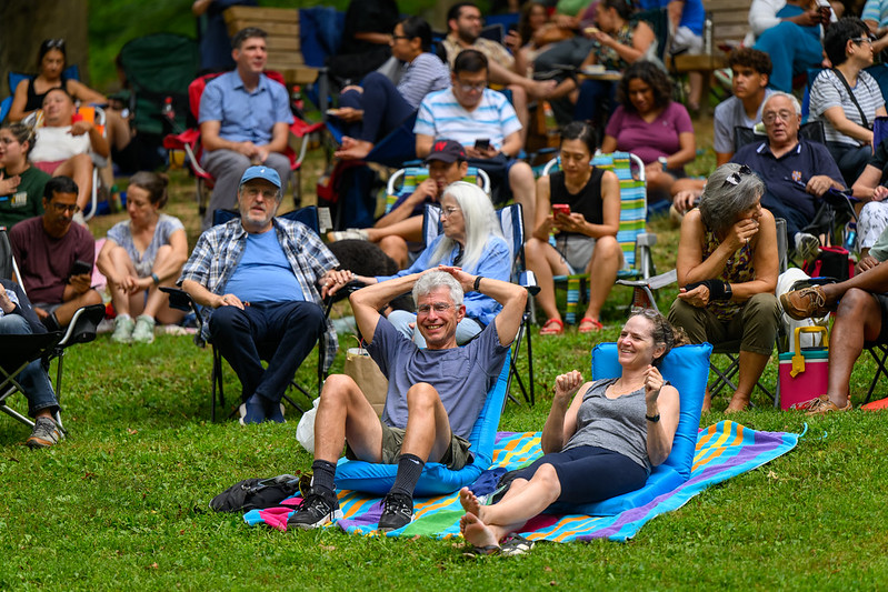 Crowd on the lawn with smiling couple in focus