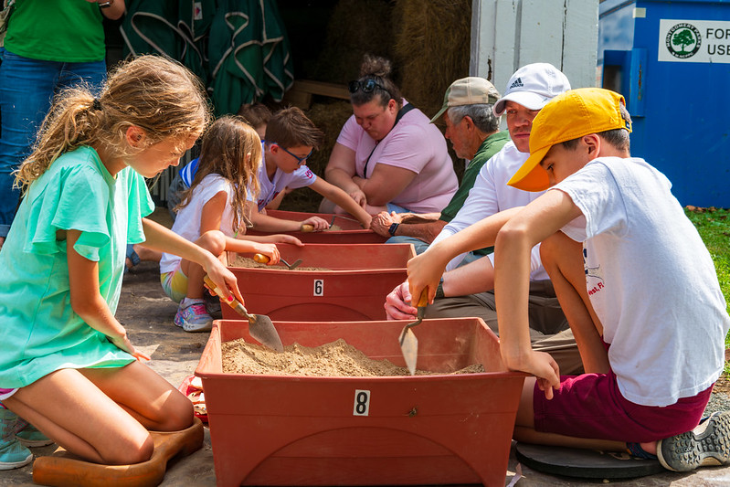 Kids digging in dirt boxes