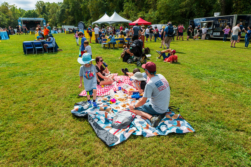 Family having picnic eating food on blanket