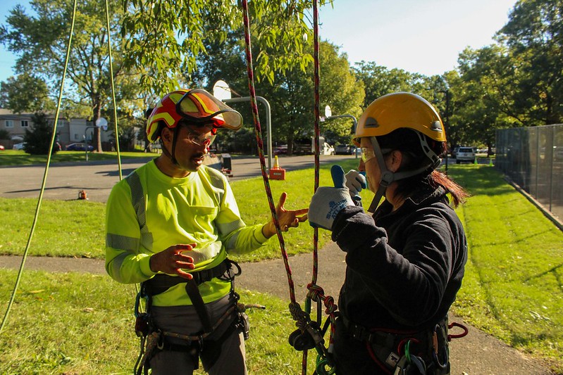 Tree crew instructor talks to attendee