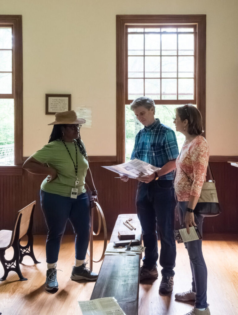 people getting a tour of Kingsley Schoolhouse