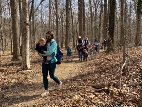 Families with small children on a hike.