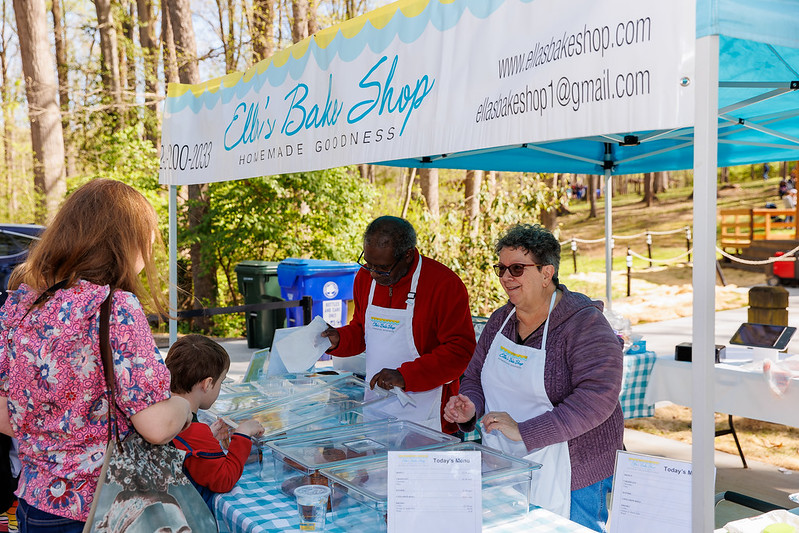 Workers from Ella's Bakeshop sell goods at Sunday Serenade 2024