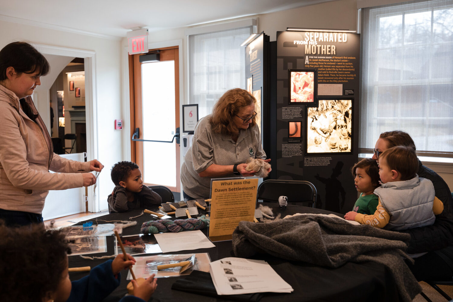 A volunteer leads an interactive session at Josiah Henson Museum and Park