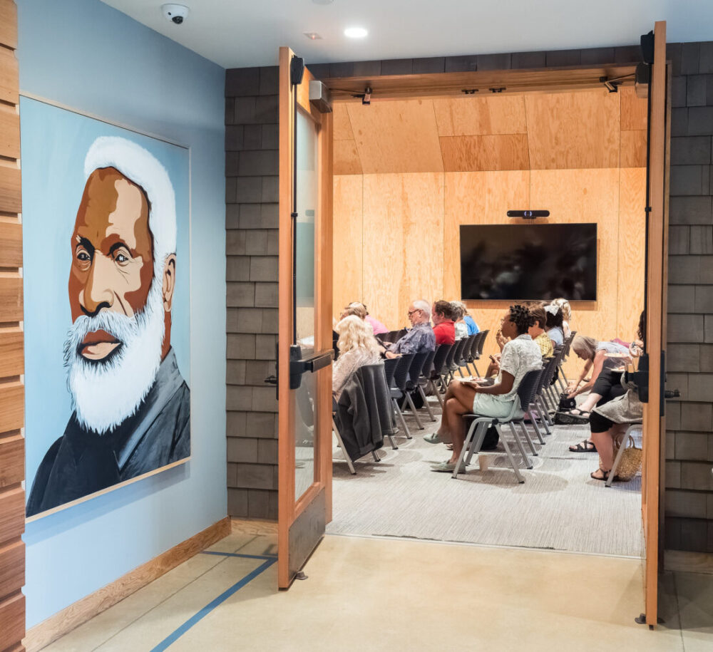 A portrait of Josiah Henson hangs on the wall outside of an auditorium at Josiah Henson Museum and Park