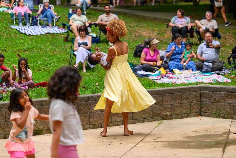 Mom holds young son as they twirl around