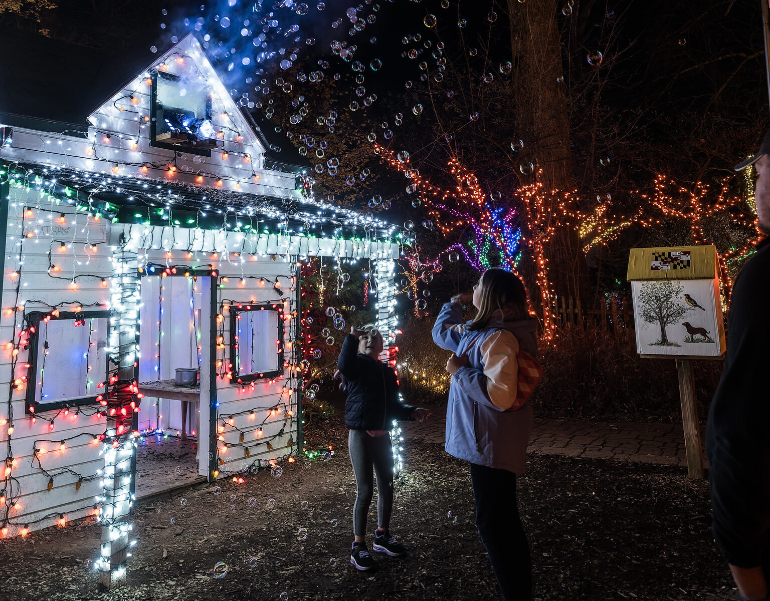 Children playing with bubbles at Garden of Lights