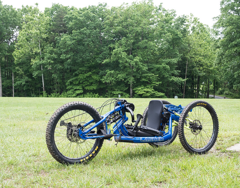 Blue tricycle in an open field