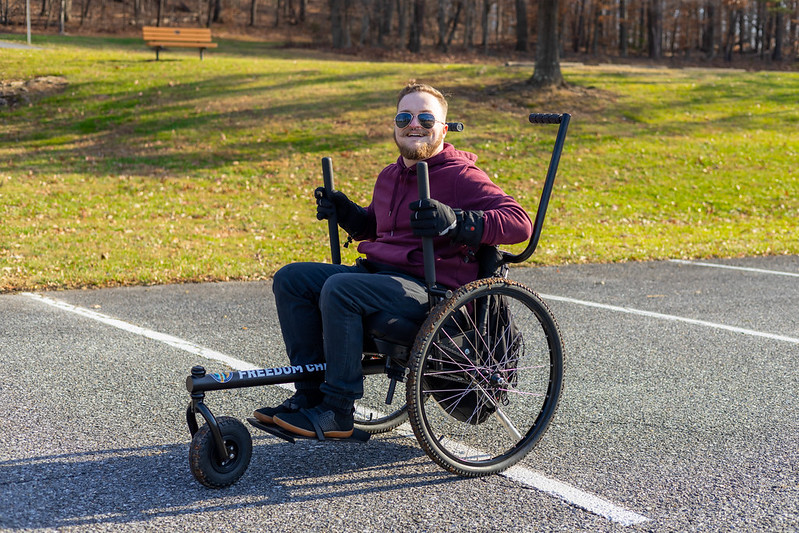 A person using an All Terrain Wheelchair