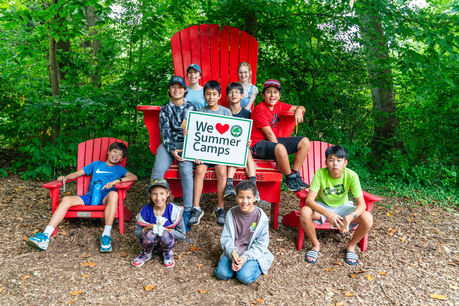 A group of kids in a big chair