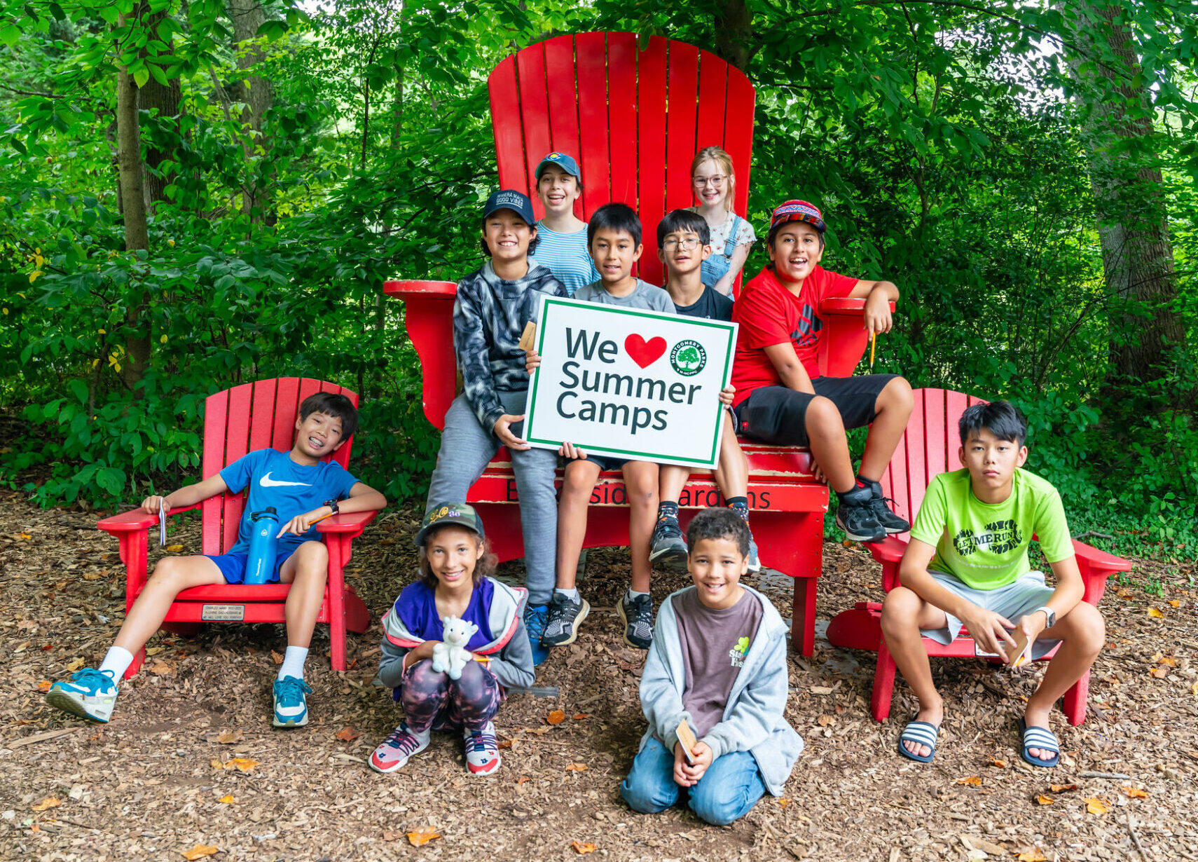 A group of kids in a big chair