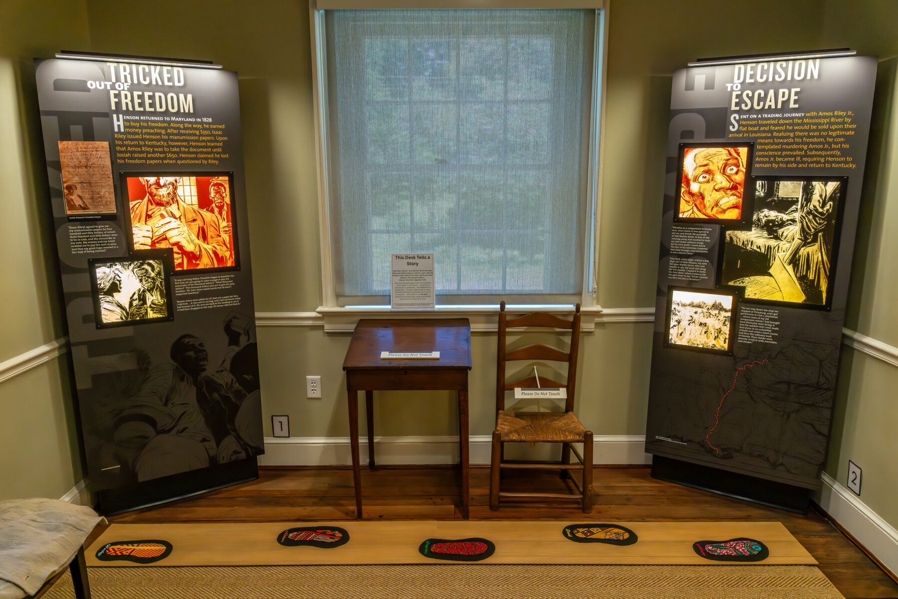 An exhibit with footstep cutouts