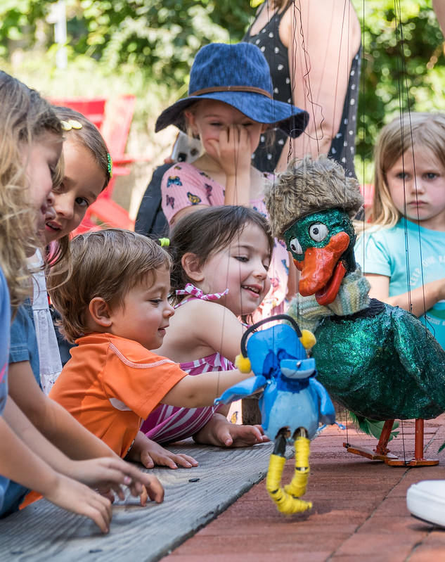 Kids attending parks playhouse event 