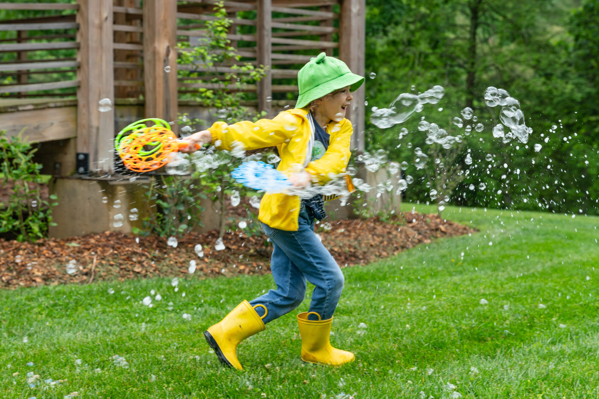 A child dancing with bubbles