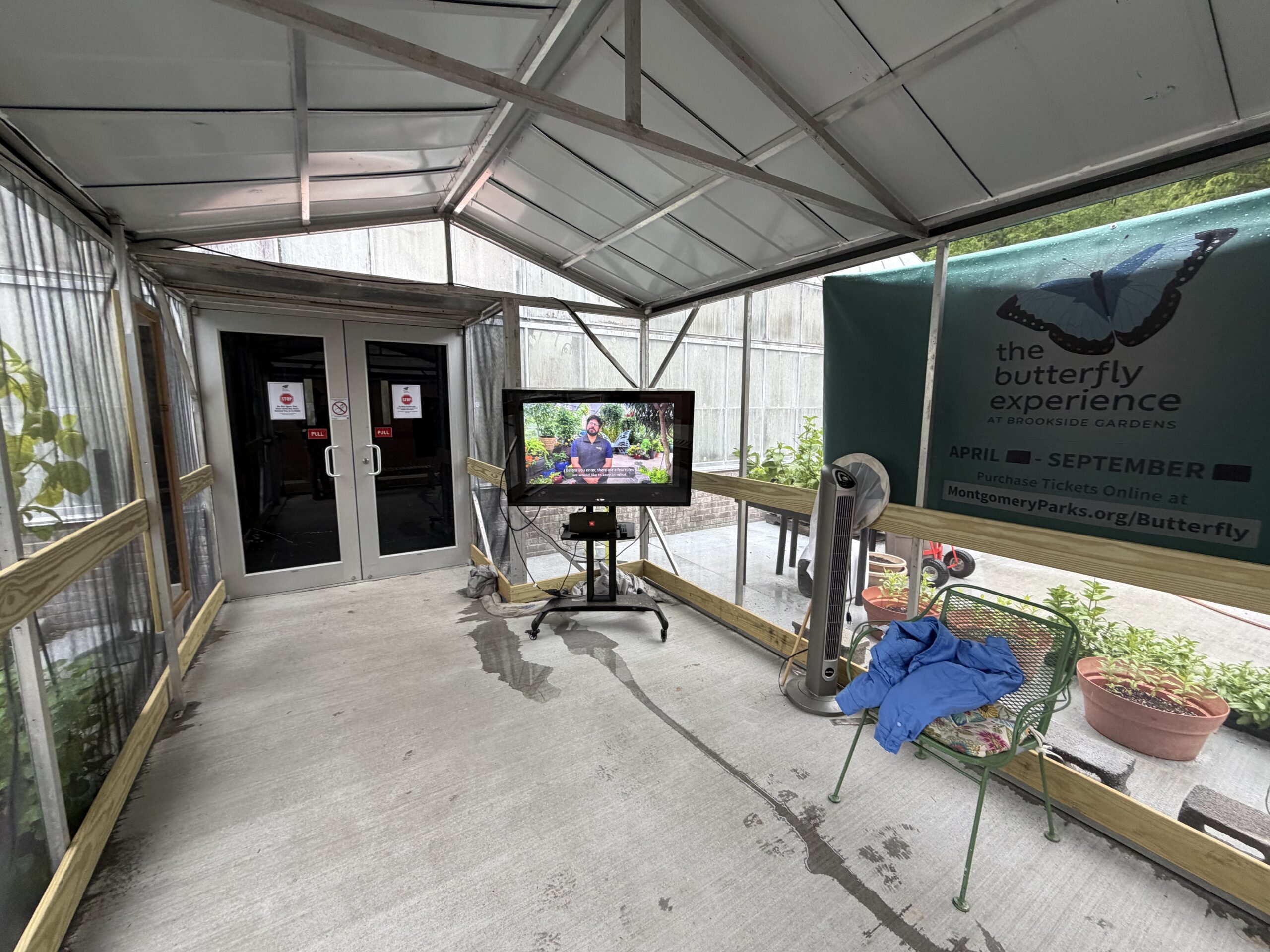Small waiting area with tv screen right outside the brookside conservatory