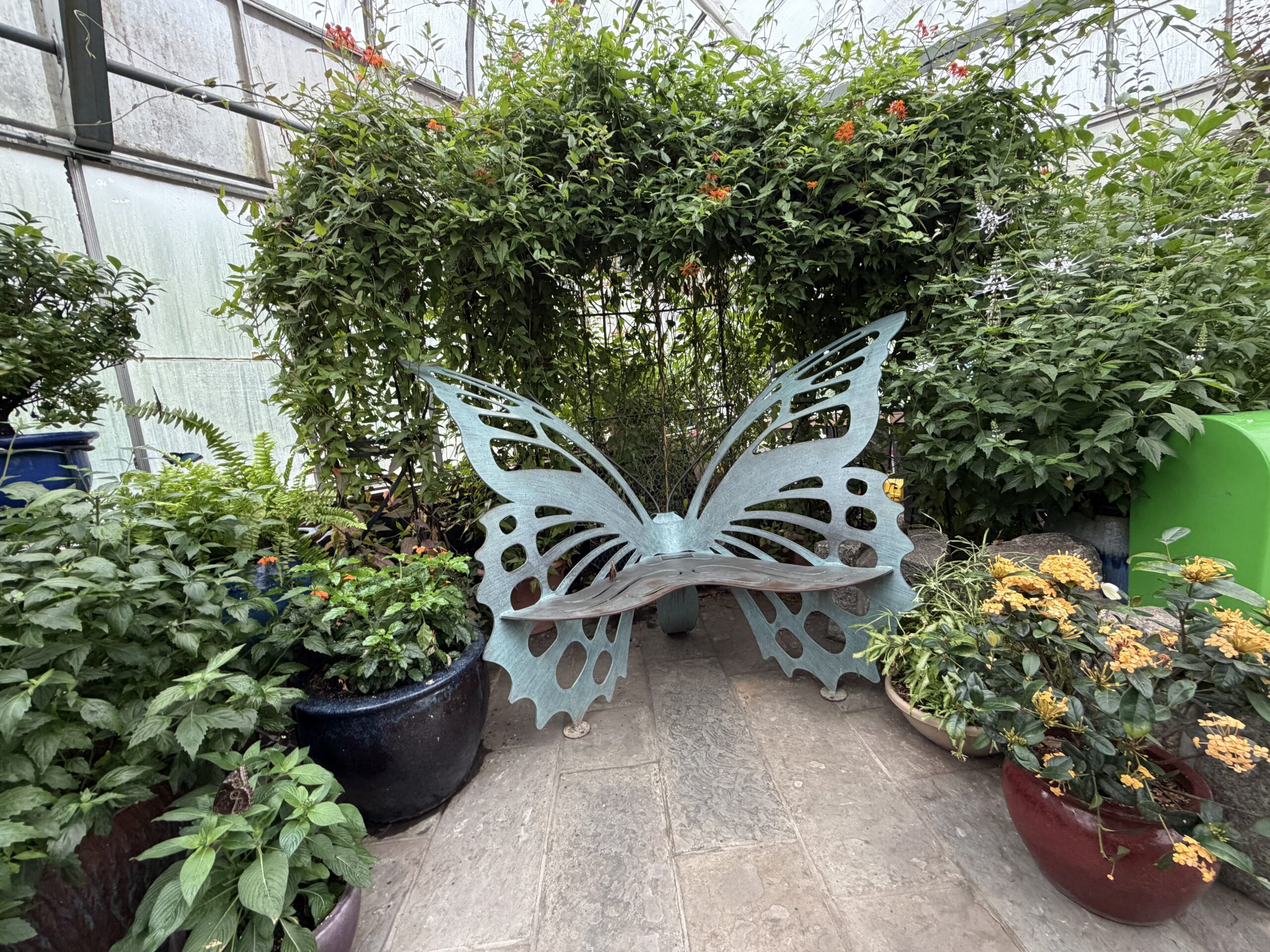 An image of an iron bench shaped like a butterfly.