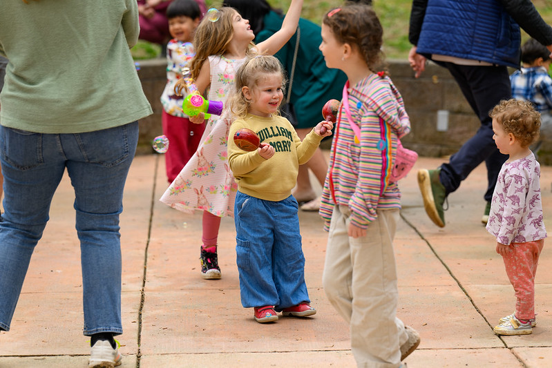 Young girl shakes maracas