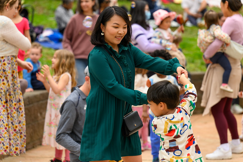 Mom dances with young son