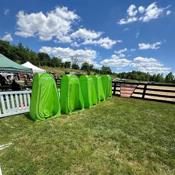 Green pop-up changing tents.