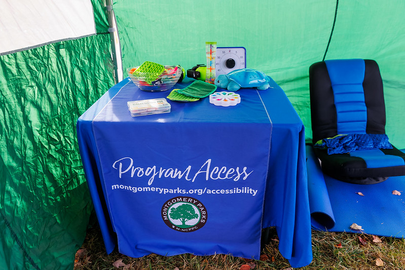 Table with sensory toys and swivel chair in tent