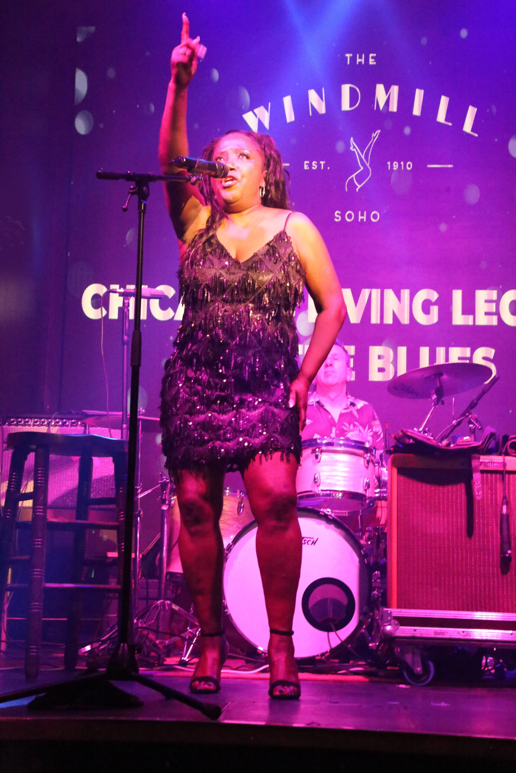 Singer Robbin Kapsalis sings on stage 