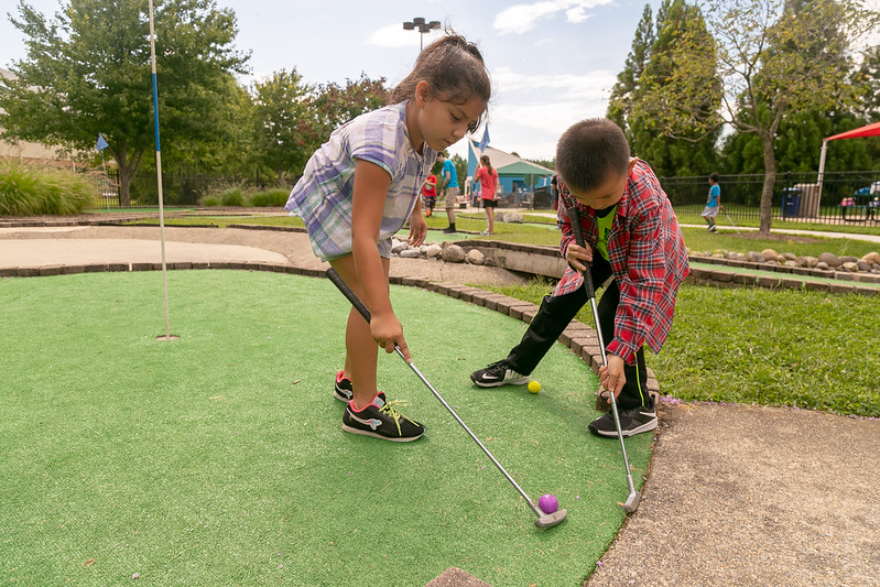 Children playing minigolf.