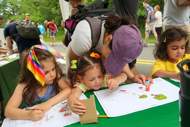 Children draw and do arts and crafts at a table