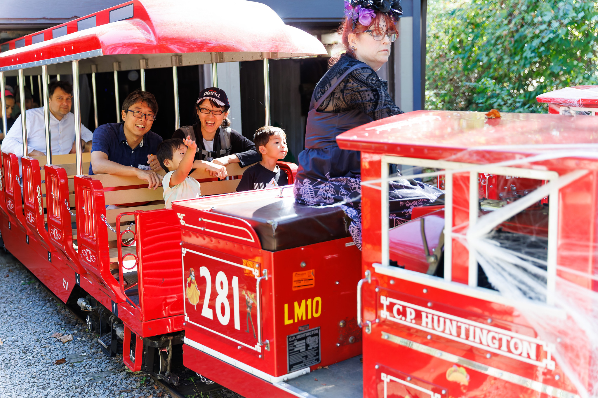A train conductor and family on the Cabin John Miniature Train