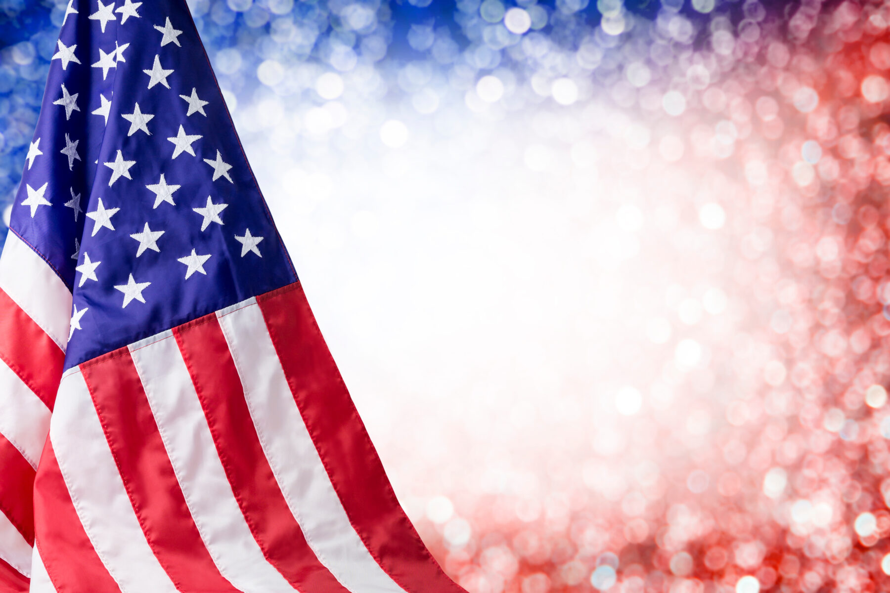 American flag on sparkly background.
