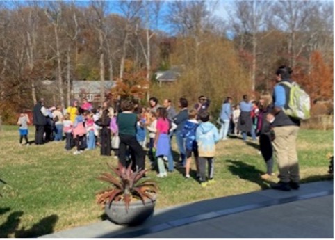 Children lined up in a line.